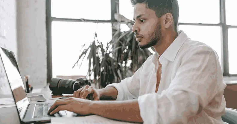 Student working on a laptop while learning an AI and machine learning course in Kerala