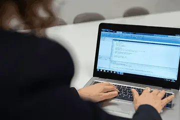 AI and ML courses coding practice shown on a laptop screen
